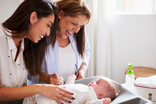 Mother and baby with support