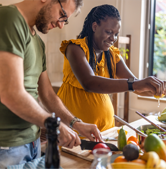 Couple cooking nutritous meal